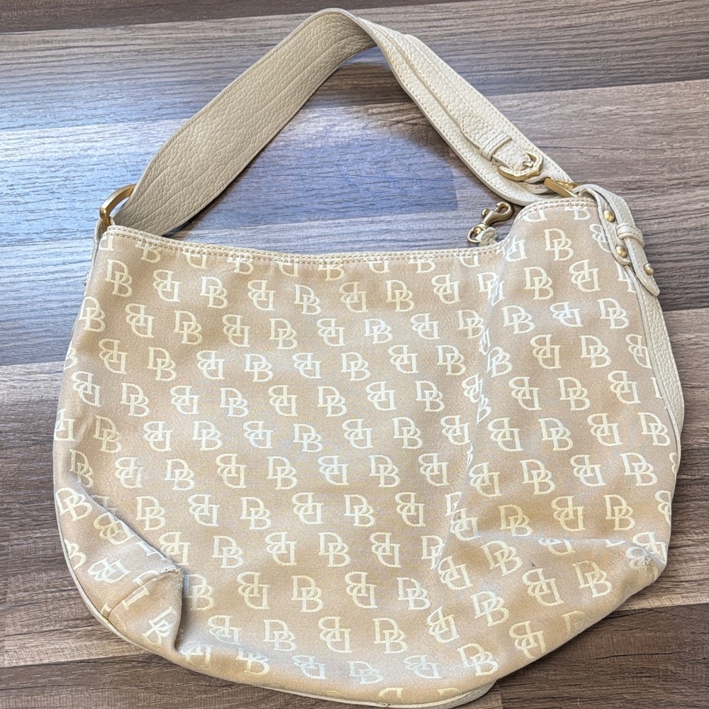 Dooney & Bourke monogram canvas hobo shoulder bag with leather trim and strap